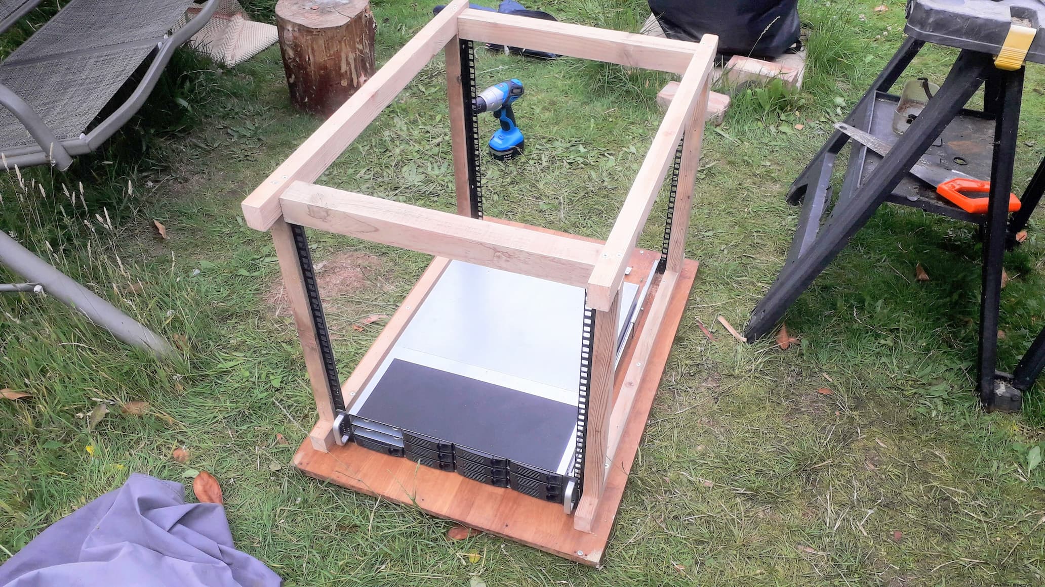 A picture showing the frame being completed with the server mounted inside using rails