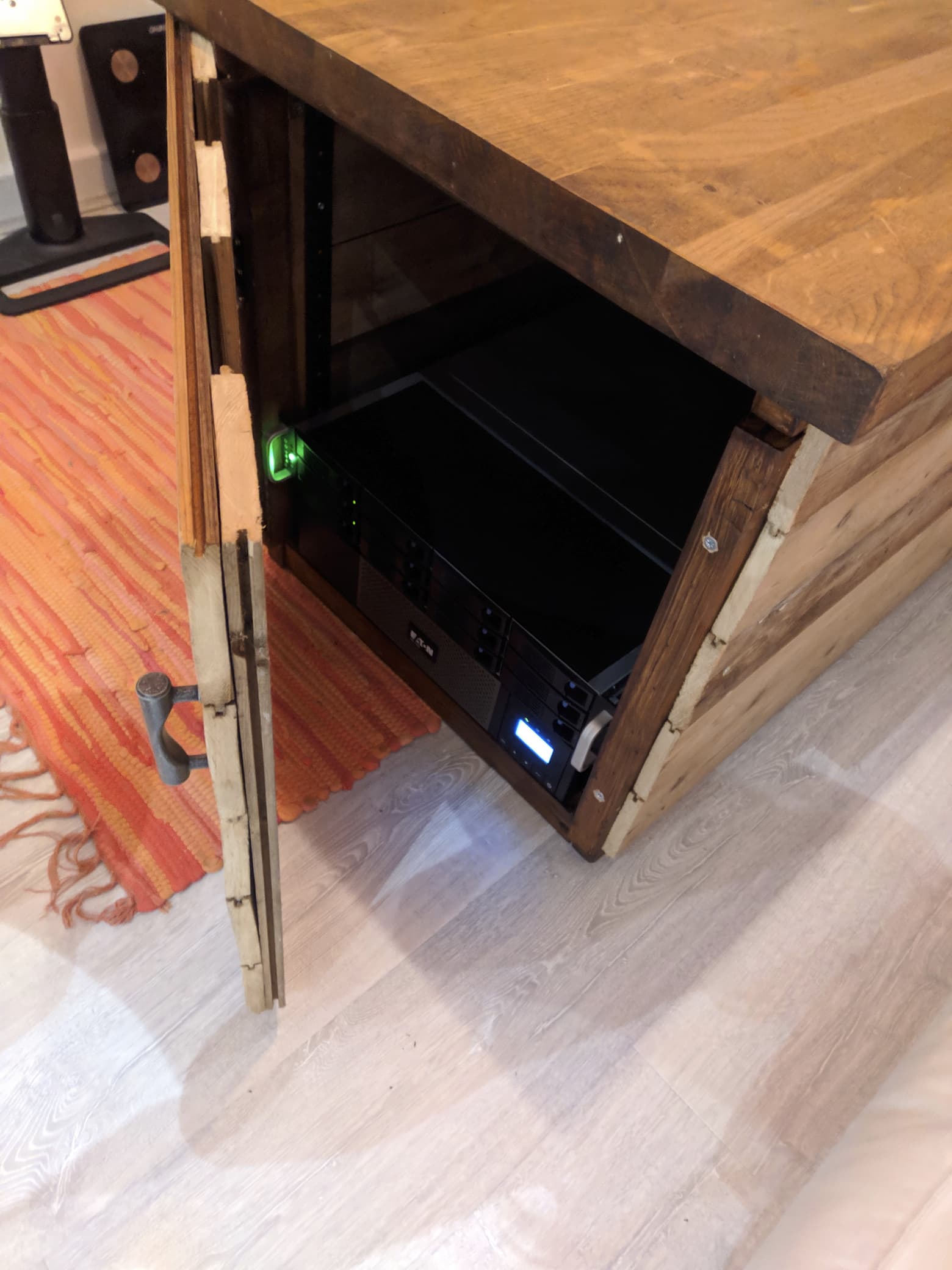 The server cabinet in-use, with the hug server and a UPS mounted inside